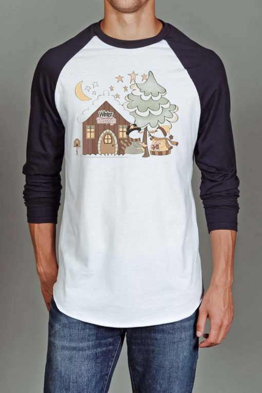 Fun Gentle Christmas Scene with Mr. and Mrs. Snowman by their little Cottage raglan T-shirt